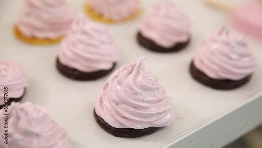 pink marshmallows on a white background in a confectionery pink marshmallows on a white background in a confectionery