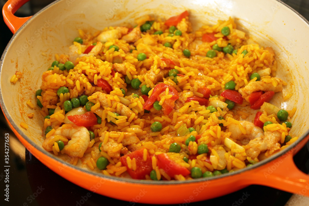 Paella cooked in a shallow casserole dish