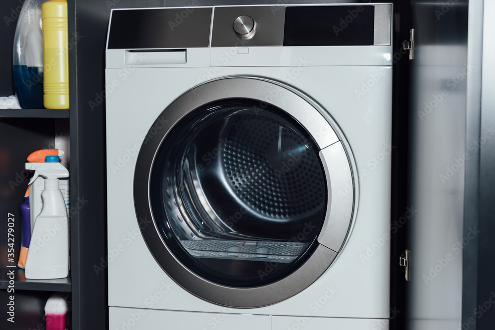 modern and white washing machine at home modern and white washing machine at home