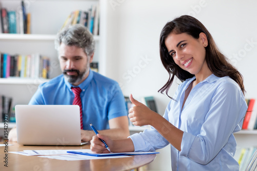 Successful mexican businesswoman with colleague