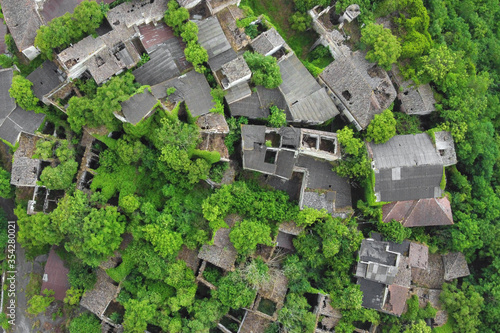 Fototapeta Naklejka Na Ścianę i Meble -  Aerial view of abandoned village in Italy. Nature is overtaken it