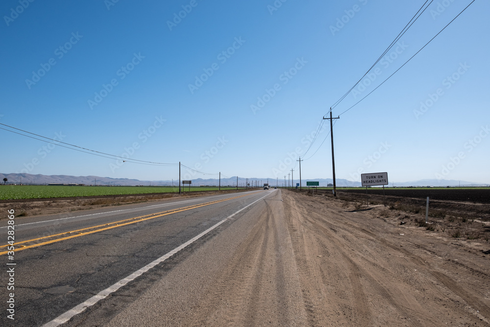 long and deserted road in the desert