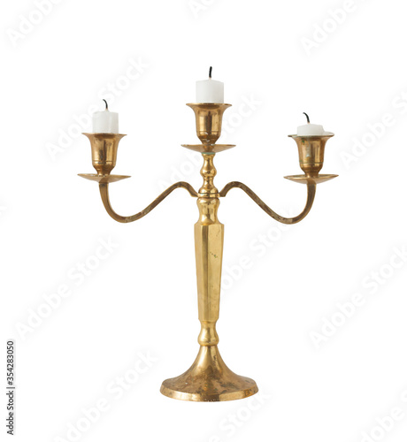 Canvas Print Gold classic candlestick with three candles on a white background