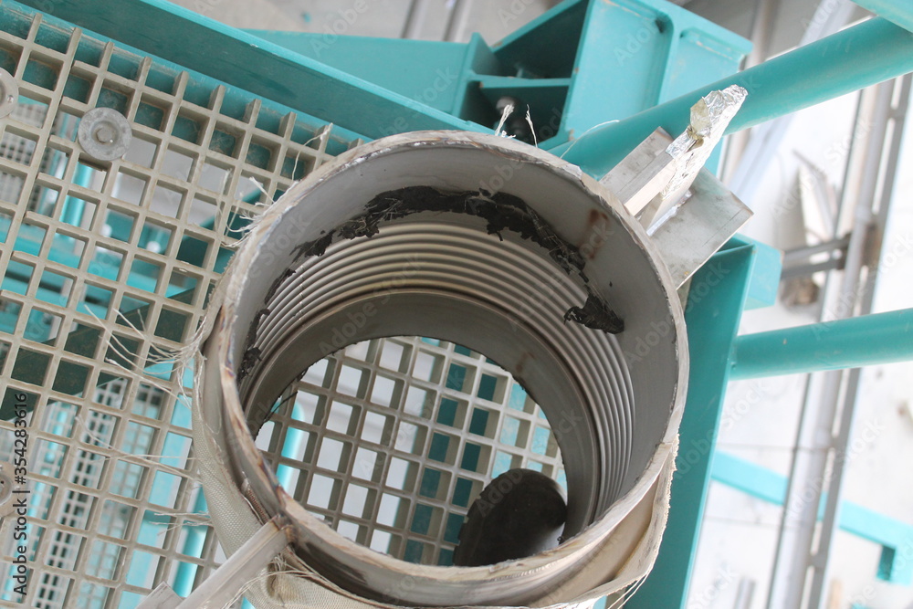 Fototapeta premium Oil pipes at a petrochemical plant in the production of oil and gas