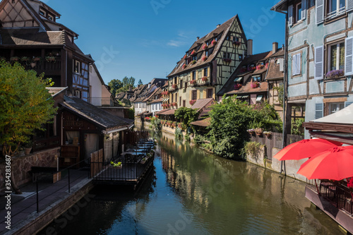 Fototapeta Naklejka Na Ścianę i Meble -  The streets of Colmar in Alsace, France include a navigable canal through the city center