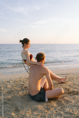 Couple enjoying the sunset on the beach