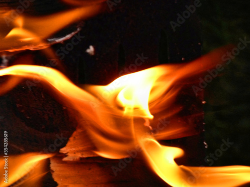 orange flame on a black background, bonfire