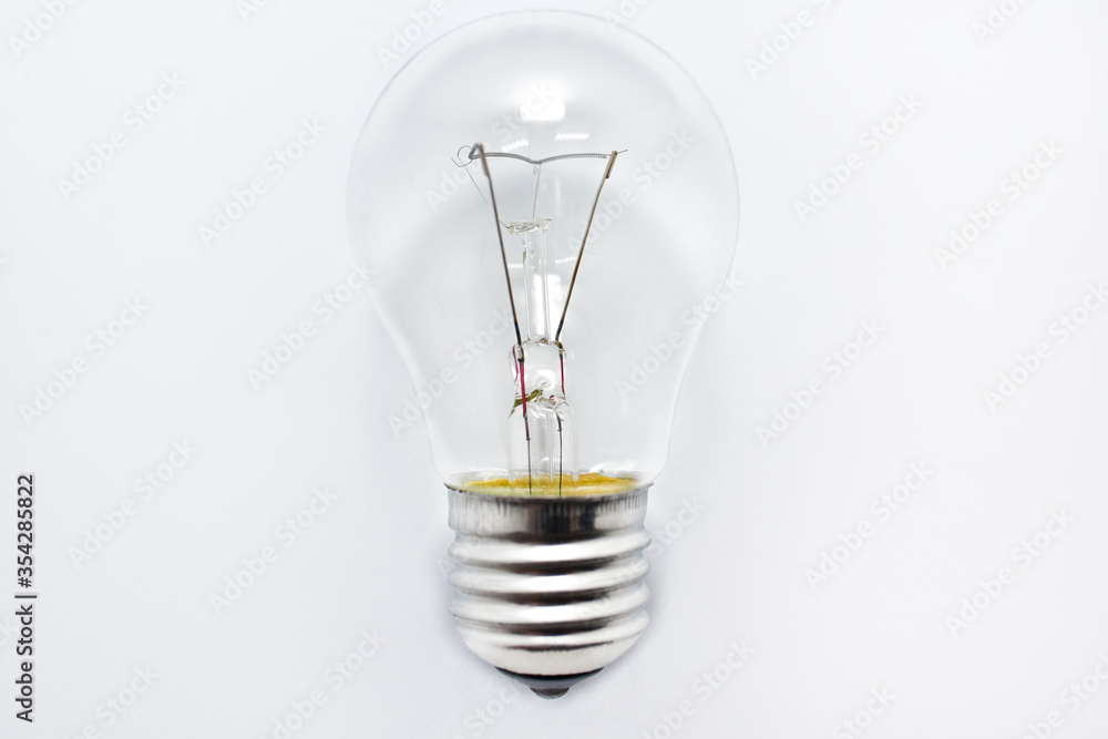 incandescent bulb lies on a white background incandescent bulb lies on a white background