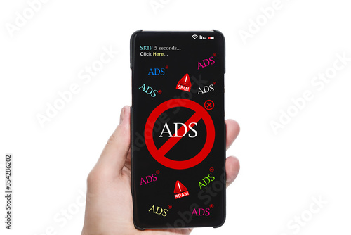 Fotografie Person's Hand Holding Mobile Phone With Screen Showing Block Ads Message Against white Background