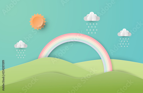 Green nature landscape scenery with mountain, rainbow, sun and clouds in paper cut style. Digital craft paper art.