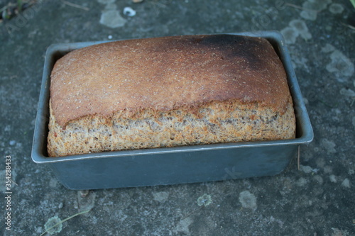 Photos Close up of organic sourdough bread, the loaf freshly wholemeal vegan vegetarian