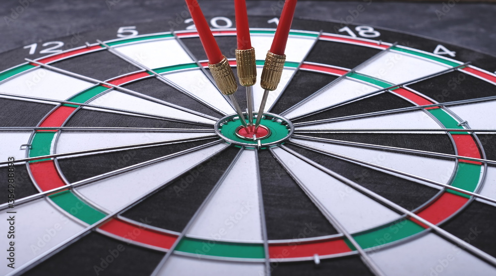 Aiming at the target, marketing, advertising and business concept. Darts game. Aiming at the target, marketing, advertising and business concept. Darts game.
