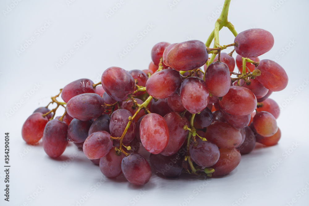 Fototapeta premium Red Grapes isolated on a white background