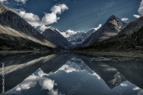 Akkem Lake at the foot of Belukha Mountain in Altai. Reflection of the mountain in the water.