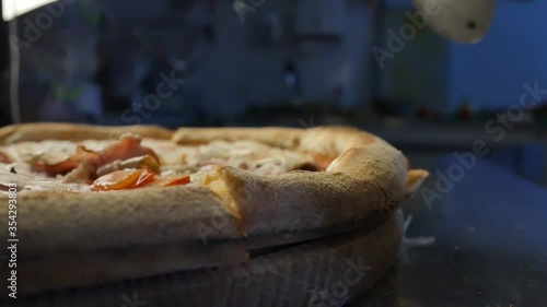 closeup of serving fresh hot pizza