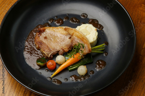Pork chop with vegetables. Exquisite dish, creative restaurant meal concept, haute couture food.