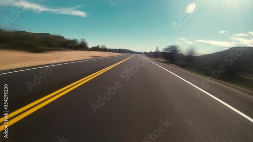Empty Desert road Driving Fast Through the Nevada Desert in Red Rock USA. TImelapsed.