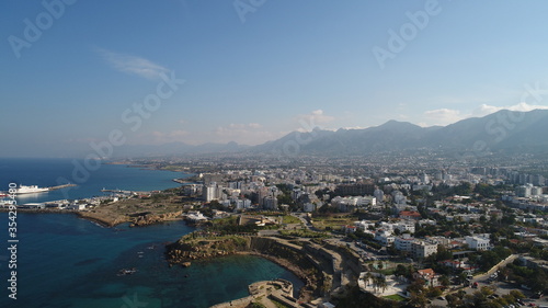 Cyprus Kyrenia Drone Footage from sky mountains city view Mediterranean sea Girne North Cyprus KKTC blue color best holiday summer sunny