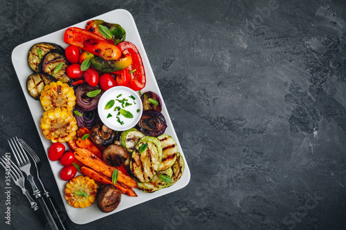 Grilled Vegetable Platter with Zucchini, mushrooms, eggplant, carrots, pepper bell, tomato, onions, corn, and Yogurt Mint Sauce