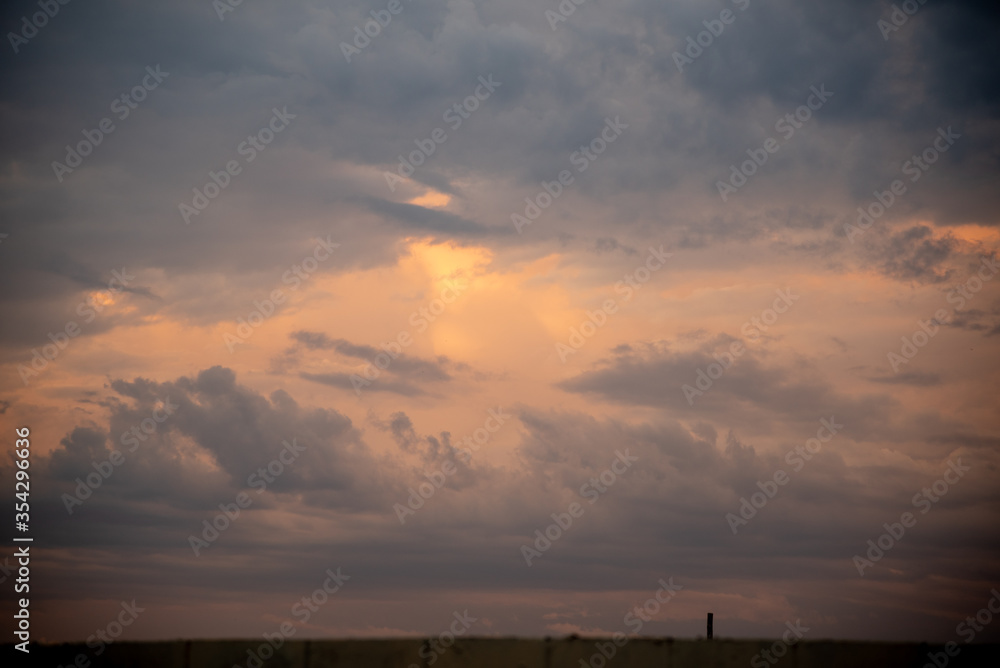Landscape and clouds at sunset in rural area in autumn in southern Brazil.NEF