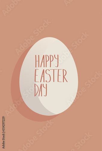 White egg with an Easter inscription on it. Coral background