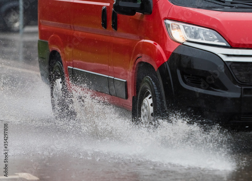 car rain puddle splashing water