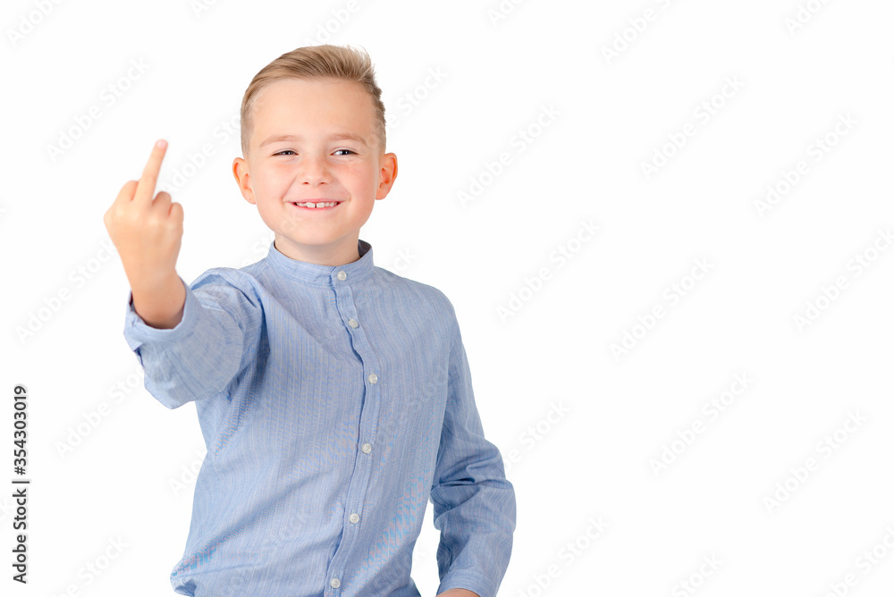 Angry teenager shows rude gesture on a white background Angry teenager shows rude gesture on a white background