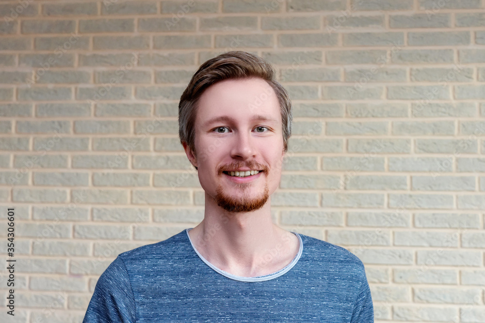 Smiling young man with red beard. Bearded man with red beard close up. Overgrown in quarantine. Smiling young man with red beard. Bearded man with red beard close up. Overgrown in quarantine.
