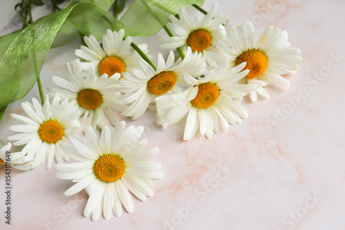 postcard mockup. bouquet of white daisies on a white background. congratulation. invitation