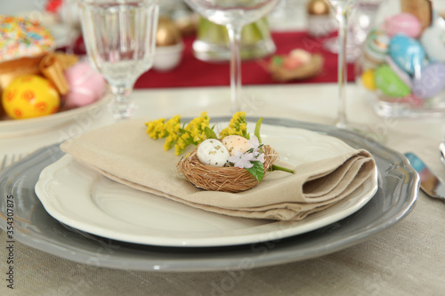 Festive Easter table setting with floral decor, closeup
