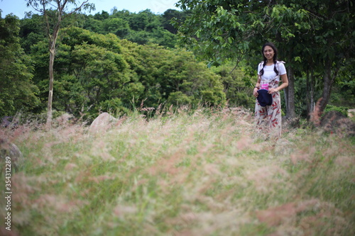 A woman standing in the meadow © pantkmutt