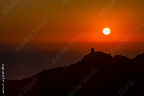 Orange sunset on mountain lanscape and sea
