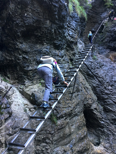 Hikers climb stairs up to the gorge.
