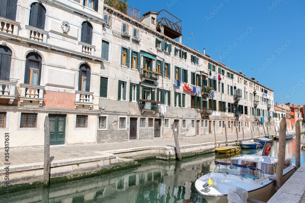 A row of houses on the canal in the middle of Venice