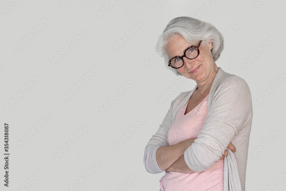 Portrait of senior woman with red eyeglasses, isolated Portrait of senior woman with red eyeglasses, isolated
