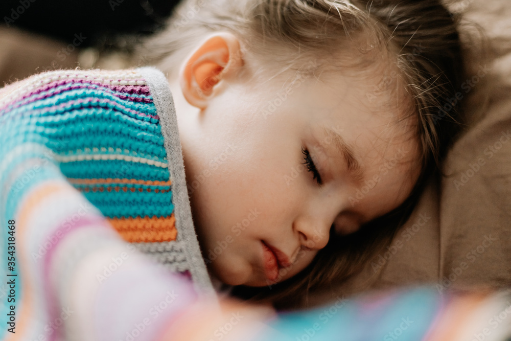 Young mother and baby of 2 years sleep together hugging, daytime sleep concept for children. Mom fell asleep with her baby while putting her to sleep Young mother and baby of 2 years sleep together hugging, daytime sleep concept for children. Mom fell asleep with her baby while putting her to sleep