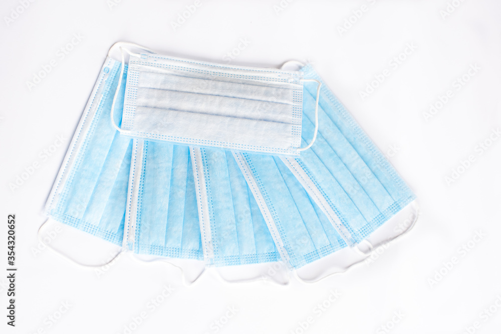 coronavirus COVID-19 pandemic. antiviral medical mask for protection against corona virus. Surgical protective mask. Medical respiratory bandage face on white background. quarantine, stay at home coronavirus COVID-19 pandemic. antiviral medical mask for protection against corona virus. Surgical protective mask. Medical respiratory bandage face on white background. quarantine, stay at home