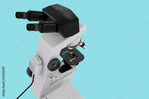 96 MPx high resolution renders of lab microscope with fictive design isolated on blue - realistic medical 3d illustration