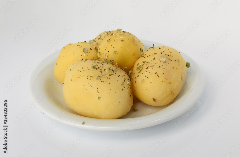 Boiled peeled potatoes on white Boiled peeled potatoes on white
