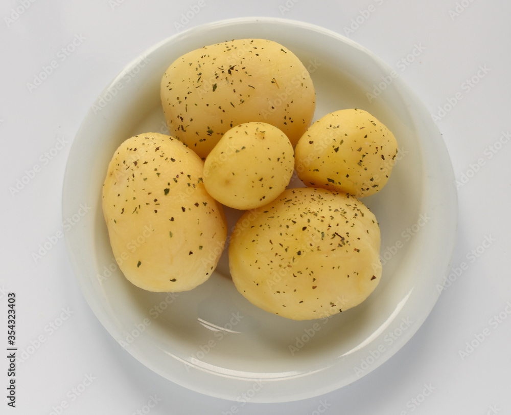 Boiled peeled potatoes on white Boiled peeled potatoes on white