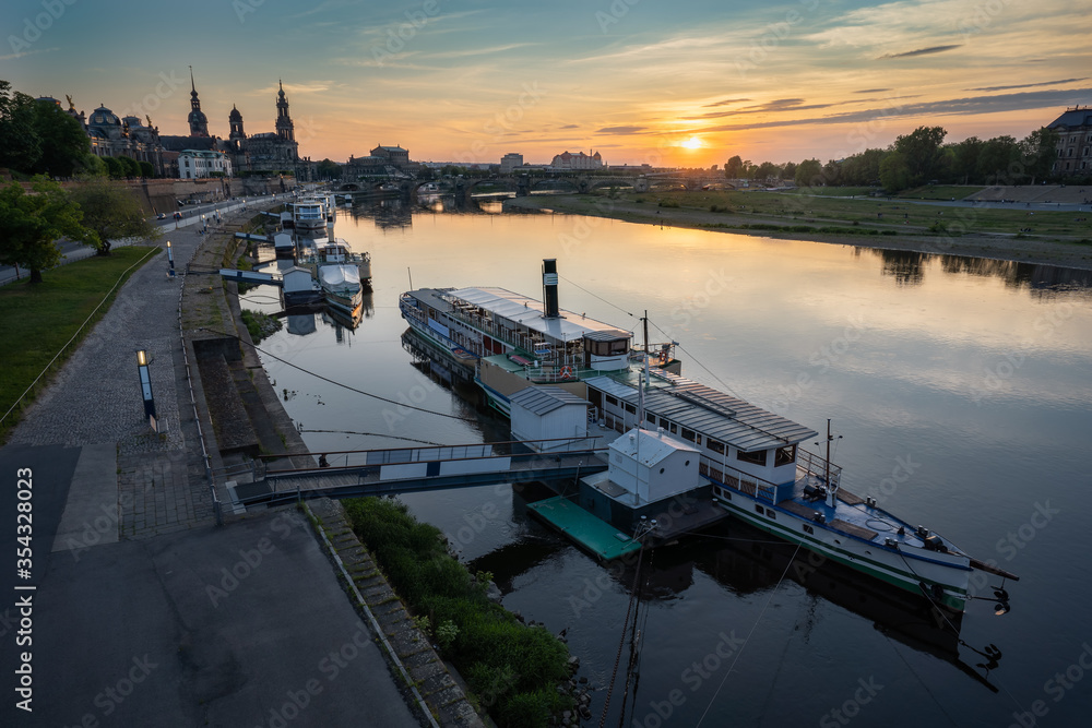 Beautiful Dresden city skyline at Elbe River and tourism pleasure steamship on pier, Dresden, Saxony, Germany