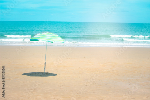 Fototapeta Naklejka Na Ścianę i Meble -  Happy summer holiday vacation, blue beach umbrella, resting and spending time to relexation on tropical island beach