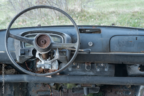 interior and old  steering wheel in metal of an old Italian car