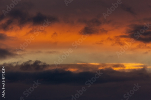 The sky before a thunderstorm. Incredibly beautiful orange sunset. © Tatiana