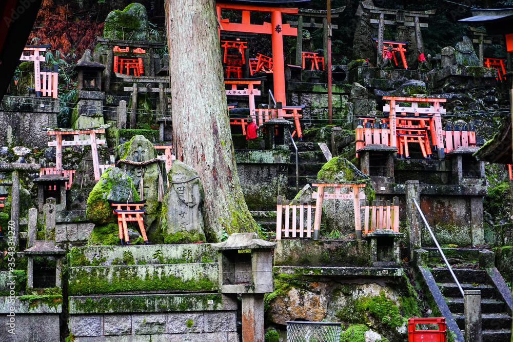 Very old temple with torii on the fushimi-inari trail, Kyoto Japan