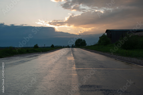 Sunset on the wet road