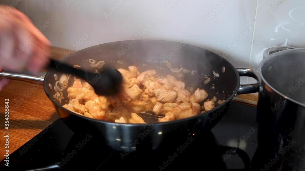 Close-up of cooking a turkey with shrimps and vegetables in wok pan. Close-up of cooking a turkey with shrimps and vegetables in wok pan.