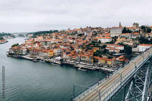 view from the bridge of the old town Porto river and houses with red tiled roofs