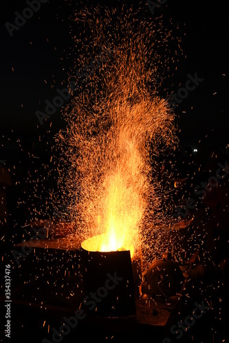Amazing Sparks in the Dark. Beautiful abstract background on the theme of fire  light and life. Sparks fly in the sky