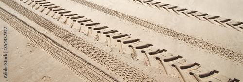 Tyre print on a sand beach photo